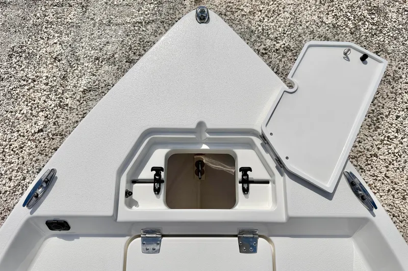Slide: The Image of Bow storage compartment of 2026 Bay Rider 219 Bay boat, open lid, white finish. - 44
