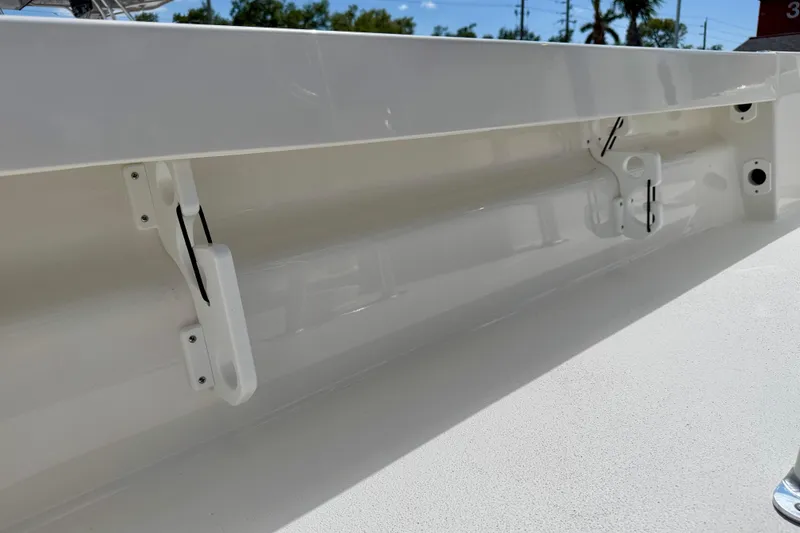Slide: The Image of 2026 Bay Rider 219 Bay boat interior detail with white finish and mounting brackets. - 46