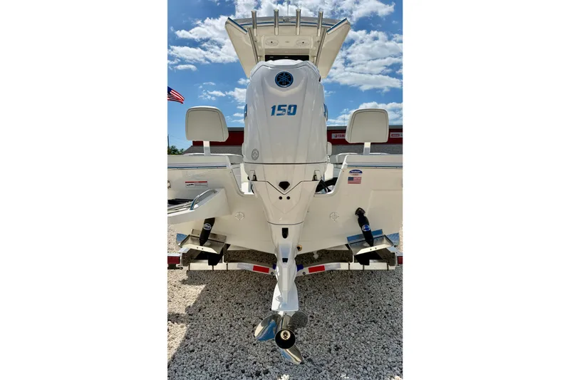 Slide: The Image of 2026 Bay Rider 219 Bay boat rear view with powerful outboard motor. - 52
