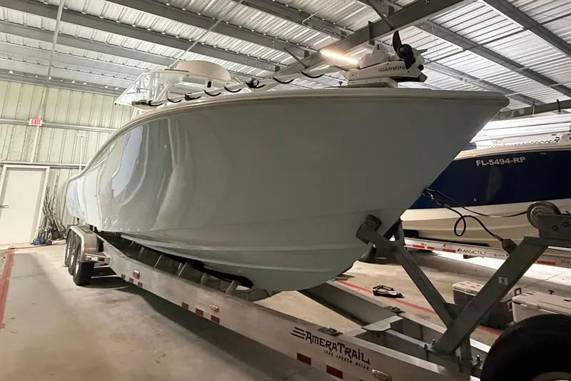 Slide: The Image of 2021 Yellowfin 36 Offshore boat on trailer in indoor storage facility. - 21