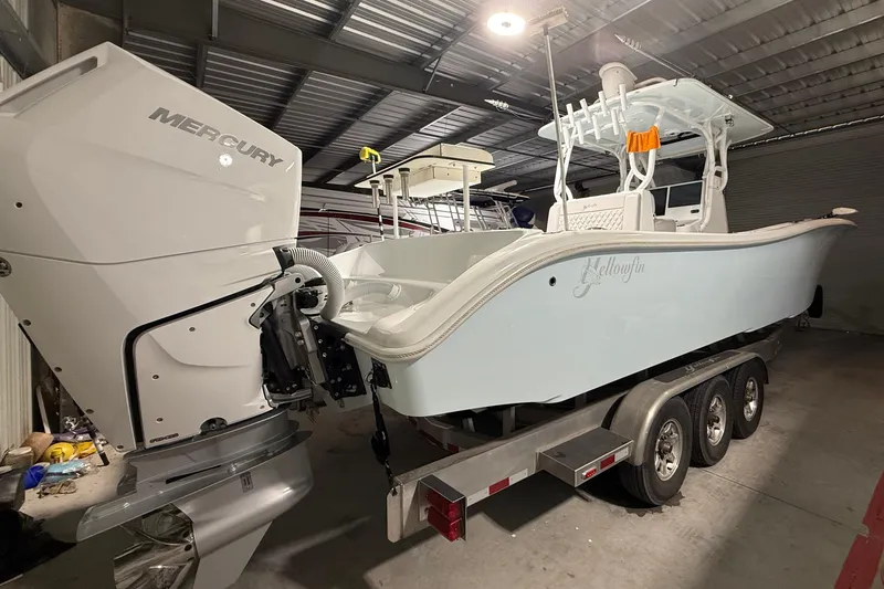 Slide: The Image of 2021 Yellowfin 36 Offshore boat with Mercury engine on trailer in a garage. - 26