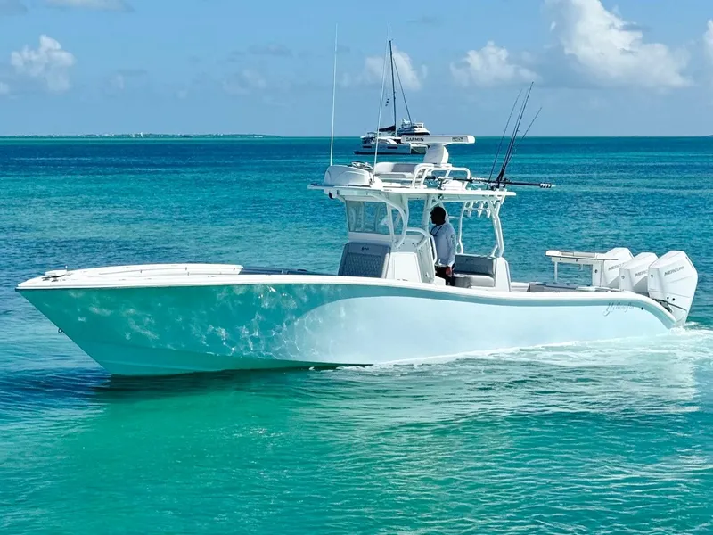 Slide: The Image of 2021 Yellowfin 36 Offshore boat cruising on clear turquoise waters. - 3