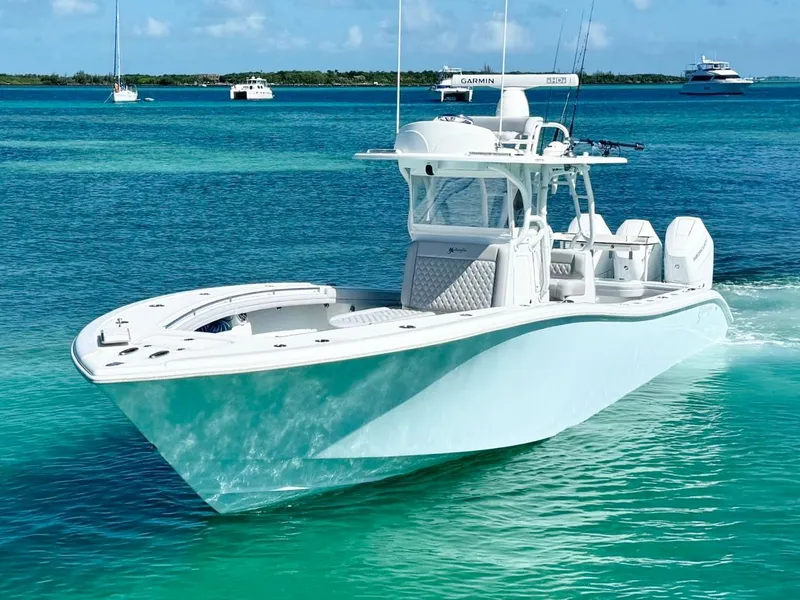 Slide: The Image of 2021 Yellowfin 36 Offshore boat cruising on clear turquoise waters. - 4