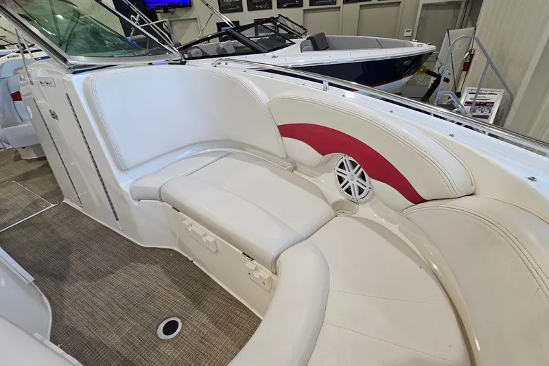 Slide: The Image of Interior of a 2000 Chaparral 230 SSi boat with white and red seating. - 16