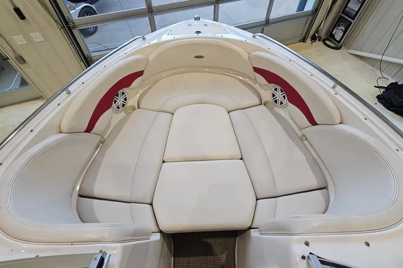 Slide: The Image of Spacious seating area on a 2000 Chaparral 230 SSi boat with white upholstery. - 18