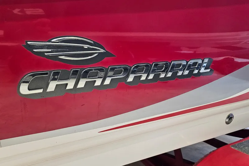 Slide: The Image of Red Chaparral 230 SSi boat with chrome logo, model year 2000. - 25