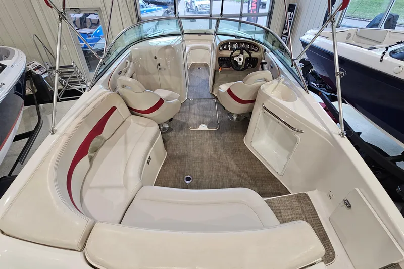 Slide: The Image of Interior of a 2000 Chaparral 230 SSi boat with seating and steering console. - 5