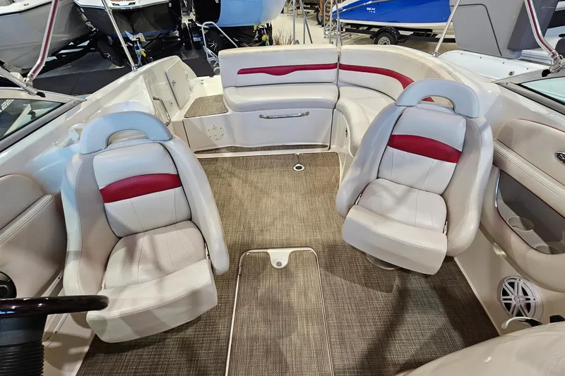 Slide: The Image of Interior of a 2000 Chaparral 230 SSi boat with white and red seating. - 6