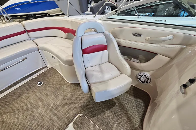 Slide: The Image of Interior of 2000 Chaparral 230 SSi boat with beige and red seating. - 8