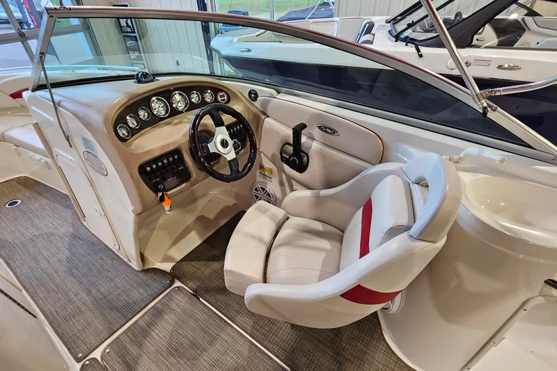Slide: The Image of Interior of 2000 Chaparral 230 SSi boat with steering wheel and dashboard controls. - 9