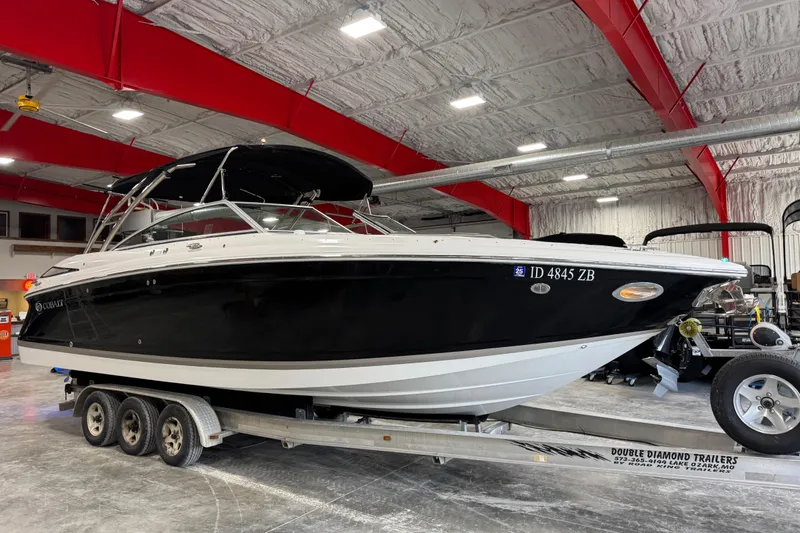 The Image of 2015 Cobalt 302 boat on trailer in indoor storage facility. - 1