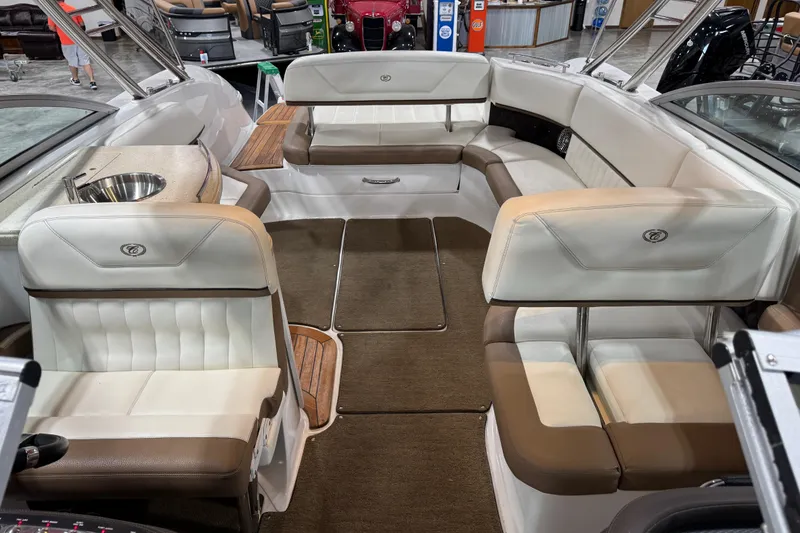 Slide: The Image of 2015 Cobalt 302 boat interior with plush seating and built-in sink. - 10