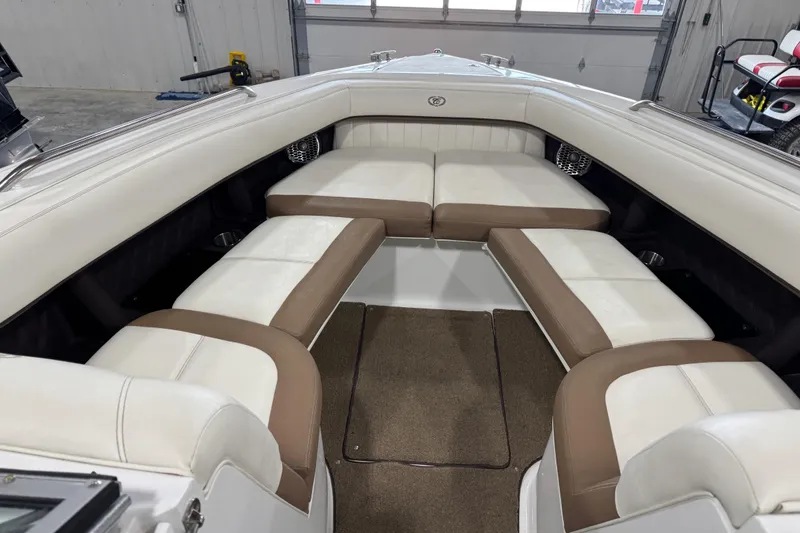 Slide: The Image of Interior of a 2015 Cobalt 302 boat with white and brown seating. - 14