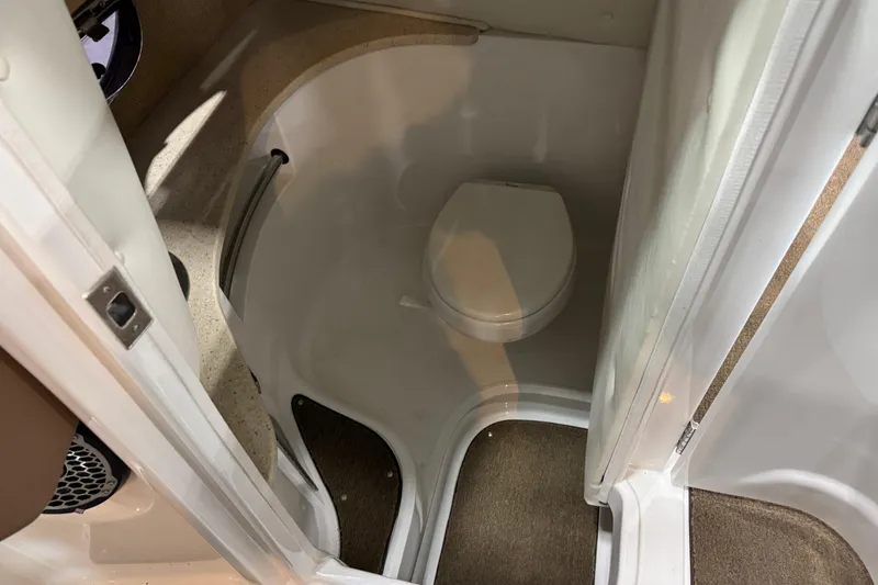 Slide: The Image of Compact bathroom in 2015 Cobalt 302 boat with toilet and countertop. - 16