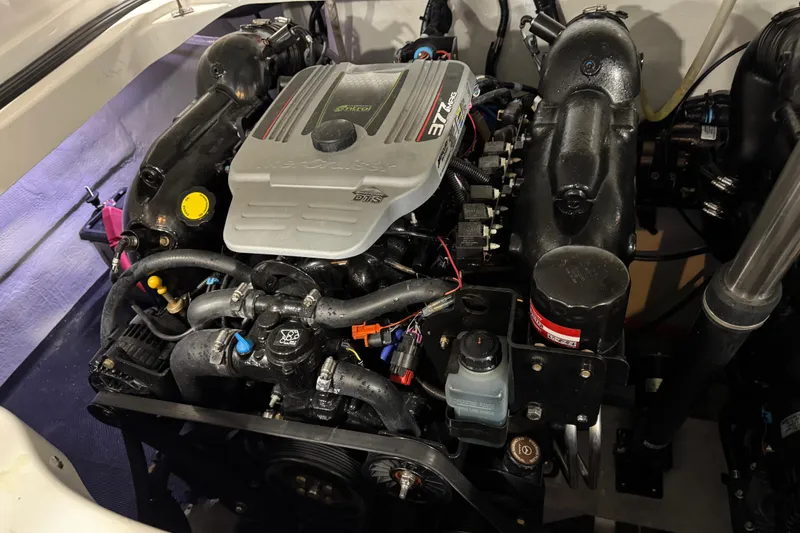 Slide: The Image of Engine of a 2015 Cobalt 302 boat, showcasing detailed components and design. - 18