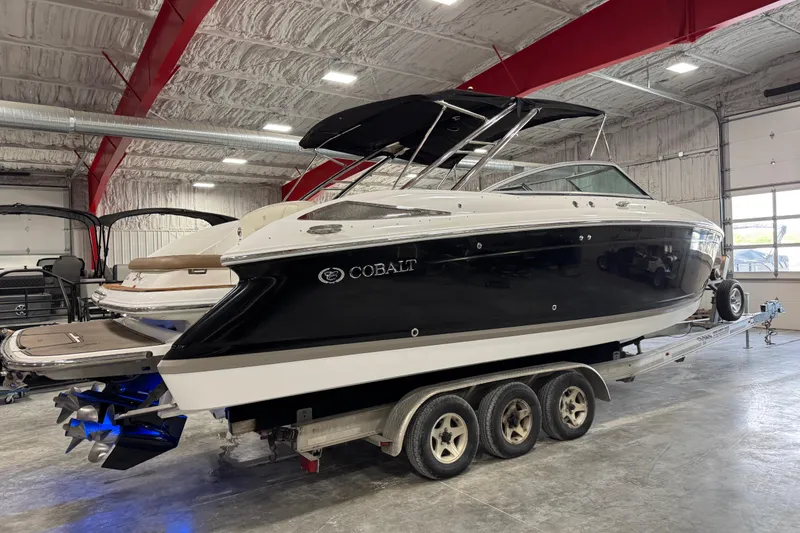 Slide: The Image of 2015 Cobalt 302 boat on trailer in indoor storage facility. - 3