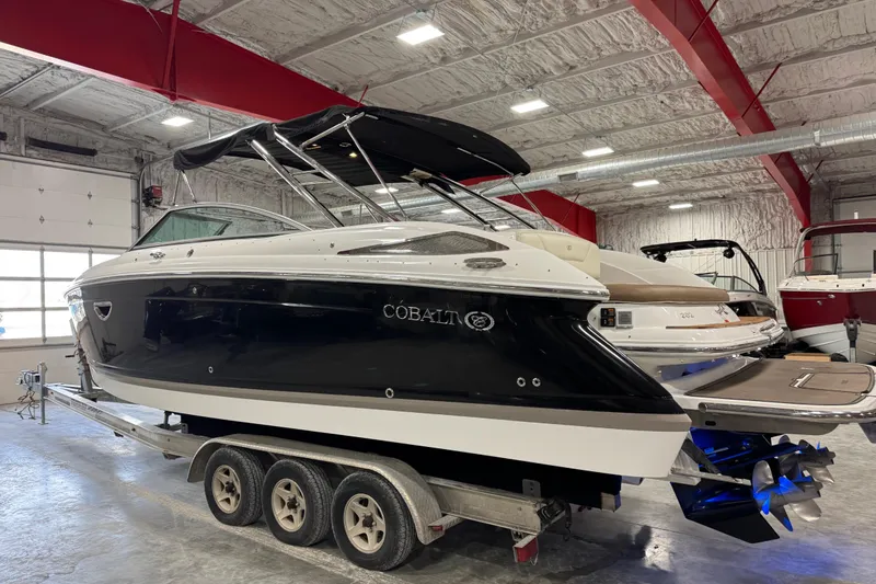 Slide: The Image of 2015 Cobalt 302 boat on trailer in indoor storage facility. - 4