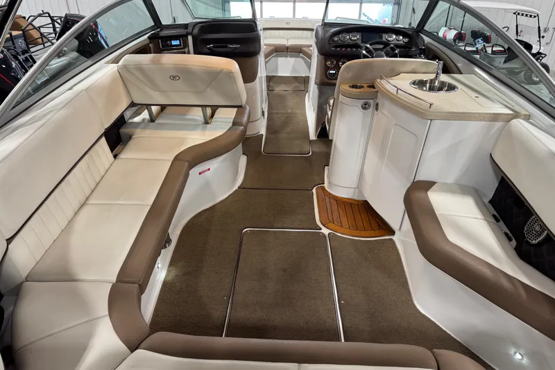 Slide: The Image of Luxurious interior of a 2015 Cobalt 302 boat with plush seating and modern amenities. - 6