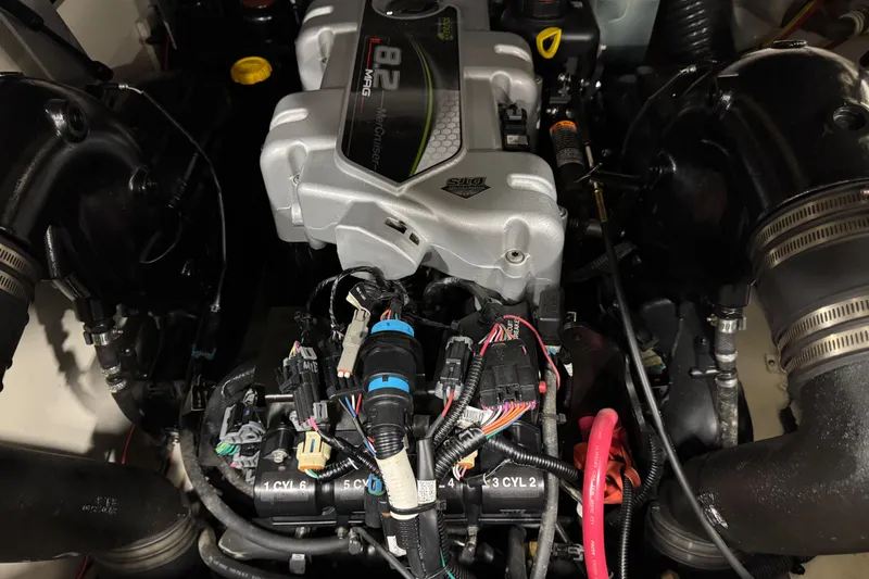 Slide: The Image of Engine compartment of a 2015 Sea Ray SDX 270 boat, featuring a powerful 8.2 MAG engine. - 15