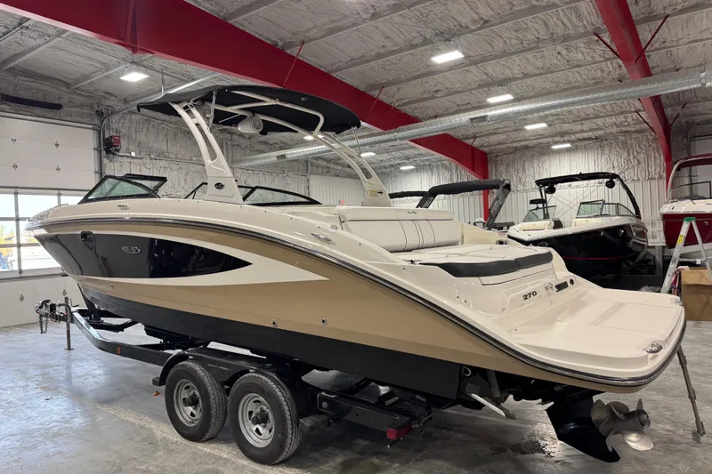 Slide: The Image of 2015 Sea Ray SDX 270 boat on trailer in indoor showroom. - 3