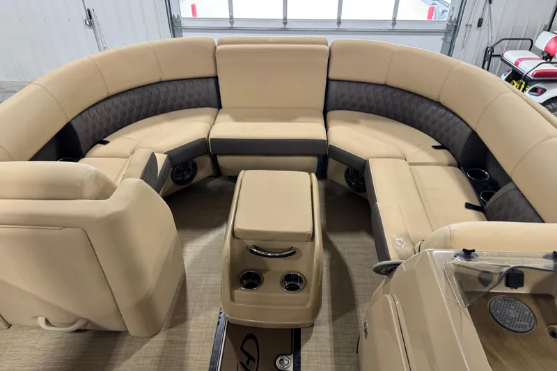 Slide: The Image of Luxurious seating area of 2022 Harris Sunliner 230 pontoon boat with beige upholstery. - 12