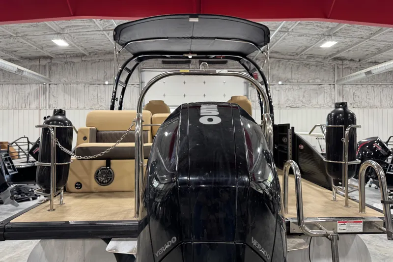 Slide: The Image of 2022 Harris Sunliner 230 pontoon boat with powerful outboard motor in a showroom. - 5