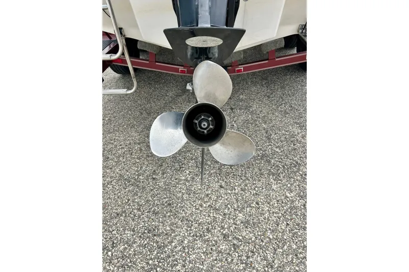 Slide: The Image of Propeller of a 1994 Stratos 290 Ski-N-Fish boat on a trailer. - 11