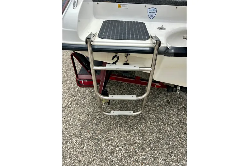 Slide: The Image of 1994 Stratos 290 Ski-N-Fish boat with stainless steel swim ladder. - 13