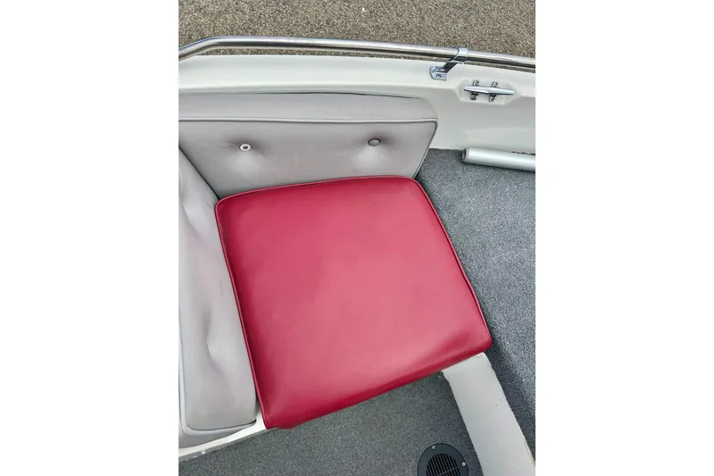 Slide: The Image of Red seat cushion in a 1994 Stratos 290 Ski-N-Fish boat interior. - 20
