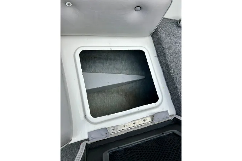 Slide: The Image of Open storage compartment in 1994 Stratos 290 Ski-N-Fish boat interior. - 21