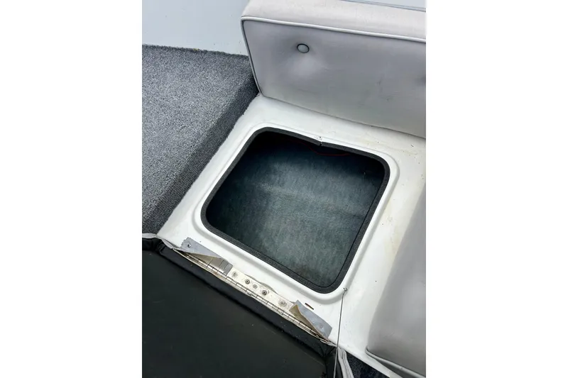 Slide: The Image of Open storage compartment in 1994 Stratos 290 Ski-N-Fish boat interior. - 23