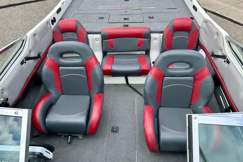 Slide: The Image of 1994 Stratos 290 Ski-N-Fish boat interior with red and gray seating arrangement. - 26