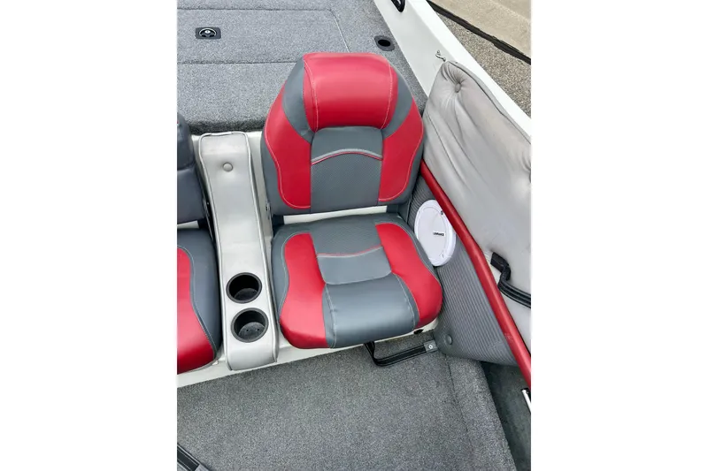 Slide: The Image of Red and gray seats in a 1994 Stratos 290 Ski-N-Fish boat interior. - 31