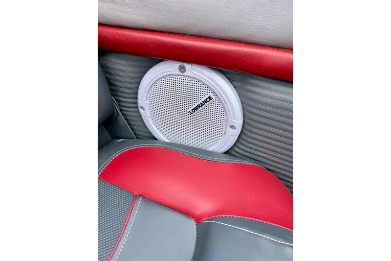 Slide: The Image of Red and gray interior of 1994 Stratos 290 Ski-N-Fish with Lowrance speaker. - 32