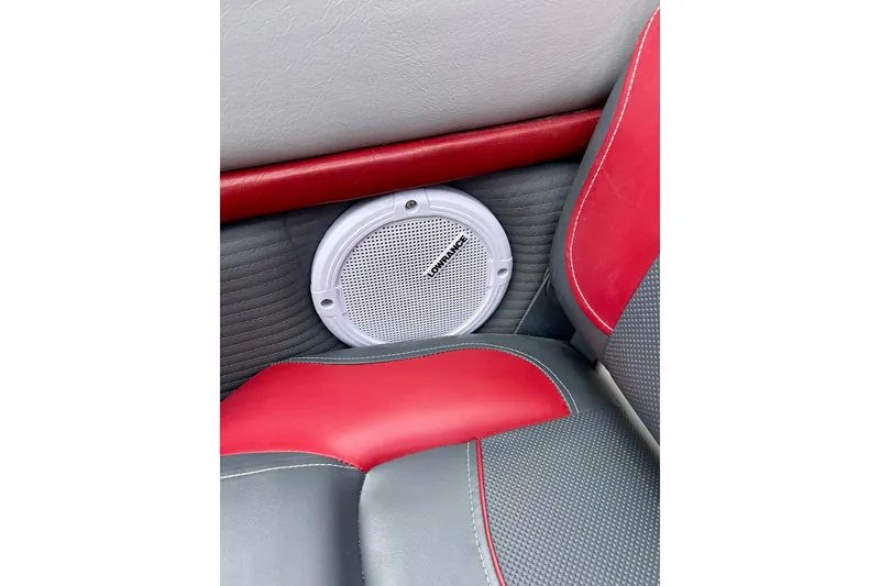 Slide: The Image of Red and gray interior of 1994 Stratos 290 Ski-N-Fish with Lowrance speaker. - 33