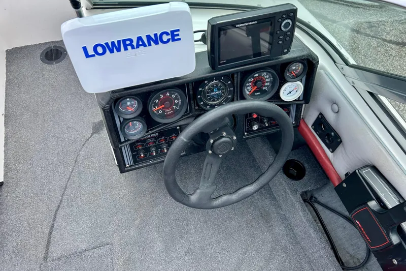 Slide: The Image of 1994 Stratos 290 Ski-N-Fish dashboard with Lowrance and Humminbird electronics. - 34
