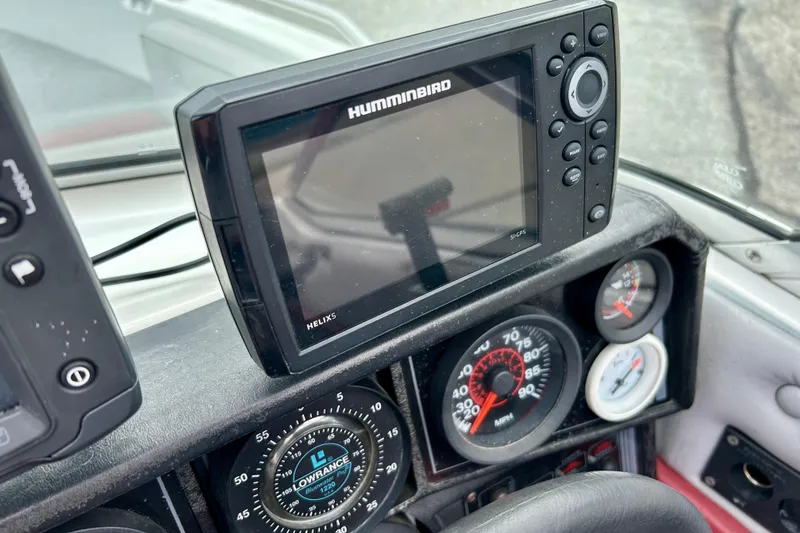 Slide: The Image of Dashboard of a 1994 Stratos 290 Ski-N-Fish with Humminbird Helix 5 GPS. - 36