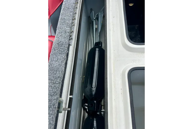 Slide: The Image of Interior view of a 1994 Stratos 290 Ski-N-Fish boat storage compartment. - 47