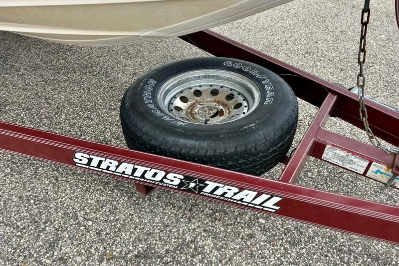 Slide: The Image of Trailer for 1994 Stratos 290 Ski-N-Fish with Goodyear tire on asphalt. - 56