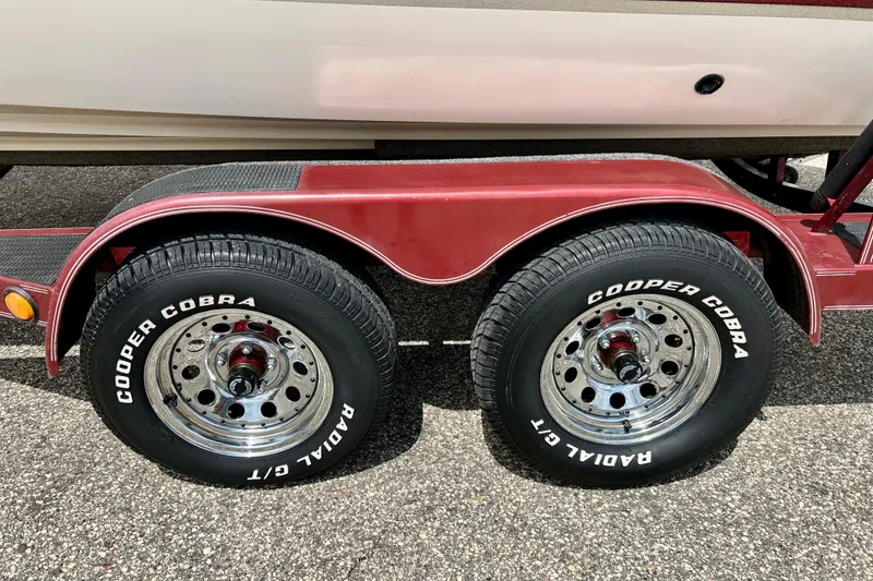 Slide: The Image of Trailer with Cooper Cobra tires for 1994 Stratos 290 Ski-N-Fish boat. - 57