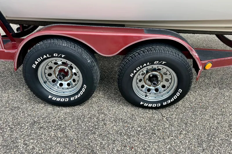 Slide: The Image of Trailer wheels of a 1994 Stratos 290 Ski-N-Fish with Cooper Cobra Radial G/T tires. - 58