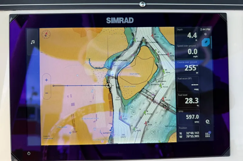 Slide: The Image of Simrad navigation display on 2023 Boston Whaler 280 Outrage boat, showing map and data. - 12