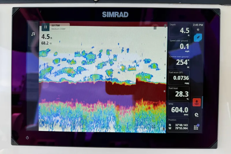 Slide: The Image of Simrad display on 2023 Boston Whaler 280 Outrage showing sonar and navigation data. - 13