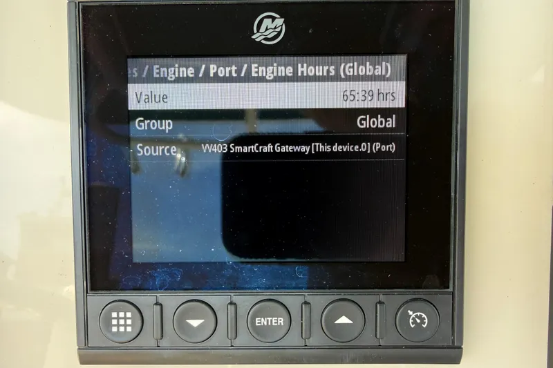 Slide: The Image of Display screen showing engine hours on a 2023 Boston Whaler 280 Outrage. - 15