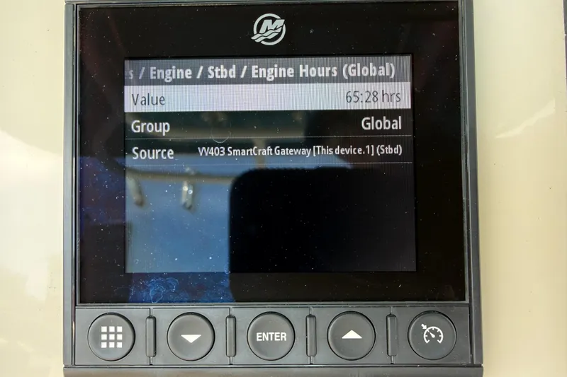Slide: The Image of Display screen showing engine hours on a 2023 Boston Whaler 280 Outrage. - 16