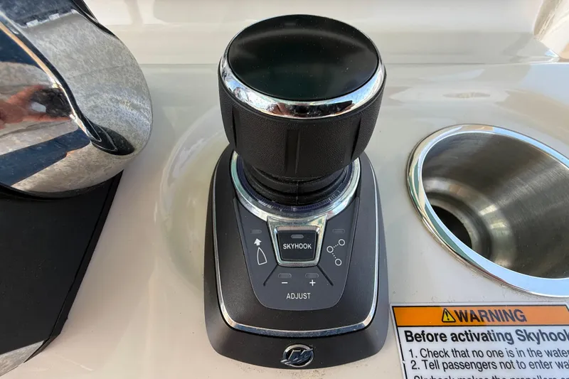 Slide: The Image of Joystick control panel on 2023 Boston Whaler 280 Outrage boat with Skyhook feature. - 18