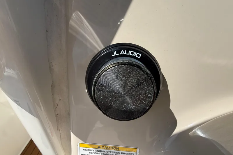 Slide: The Image of JL Audio speaker on 2023 Boston Whaler 280 Outrage boat, close-up view. - 20