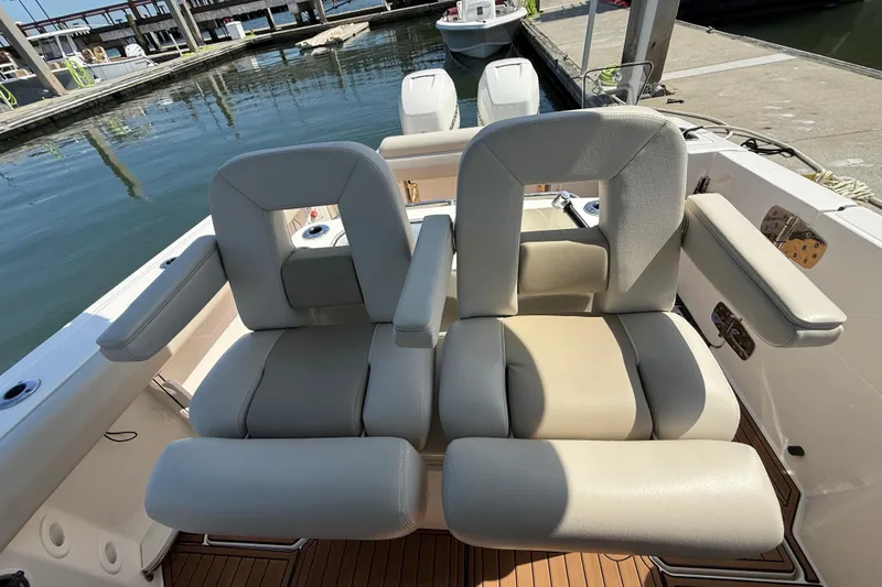 Slide: The Image of 2023 Boston Whaler 280 Outrage boat seats at marina dock. - 24