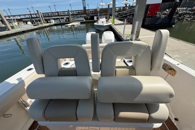 Slide: The Image of 2023 Boston Whaler 280 Outrage boat seats at marina dock. - 25