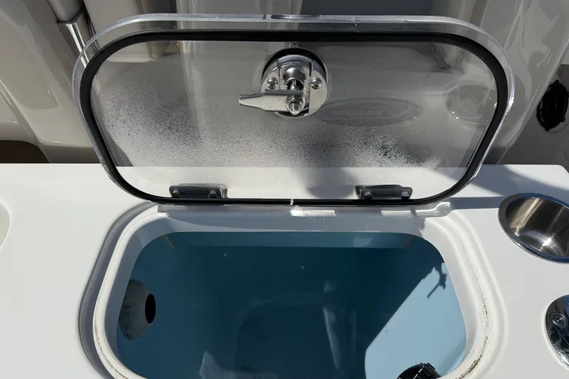 Slide: The Image of Livewell compartment on 2023 Boston Whaler 280 Outrage boat, featuring a transparent lid. - 28